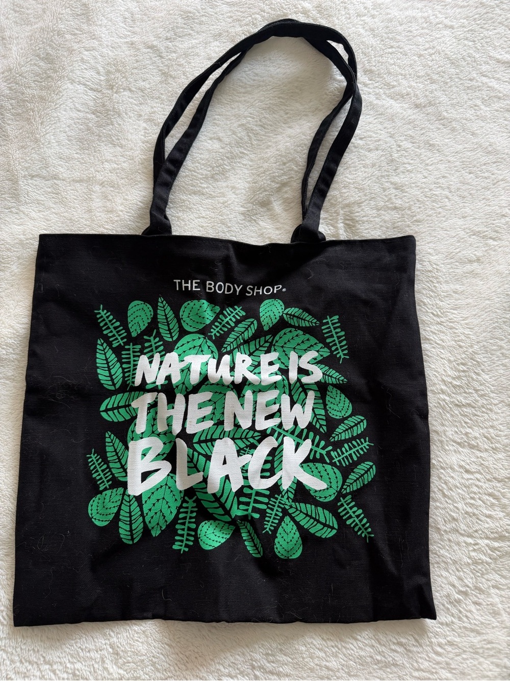The Body Shop Black Tote with Green Leaf Graphic and White Slogan